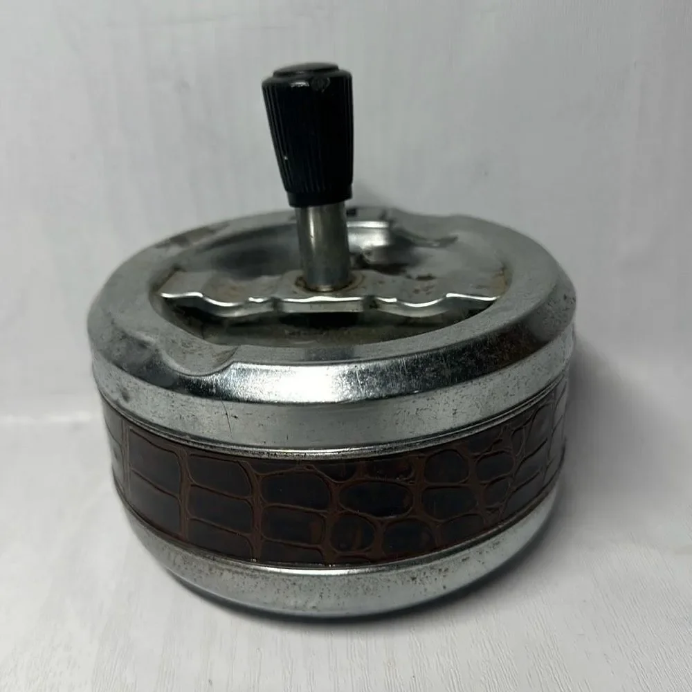 Gold Coin Metal ashtray with a snake-like pattern with a twist Made in Hong Kong